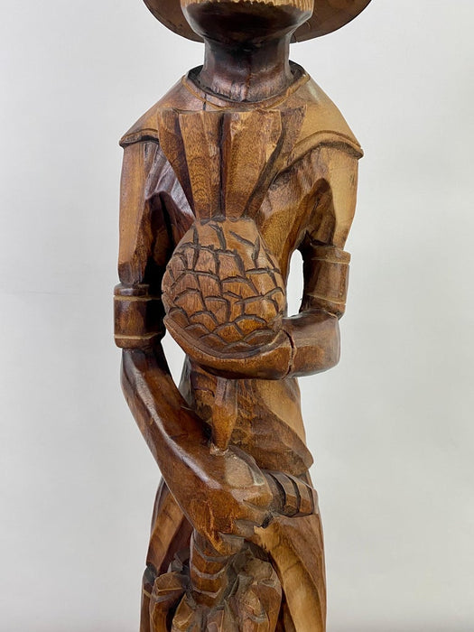 Folk Art Wood Sculpture of a Caribbean Man Holding a Pineapple