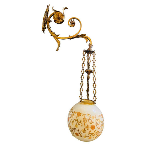 A Bronze Wall Sconce with an Eglomise Hanging Ball Light