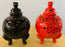 Pair of Tri-Legged Lidded Urns in Red and Black