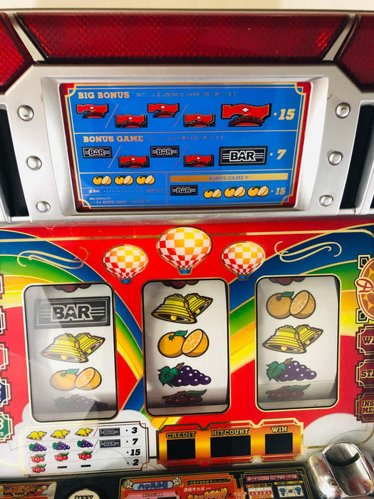 Vintage Japanese Slot Machine with Tokens