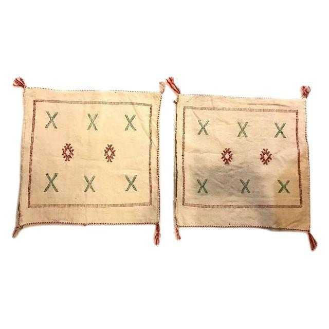 A Pair of Wool Off-White Hand-loomed Moroccan Tribal Design Pillows
